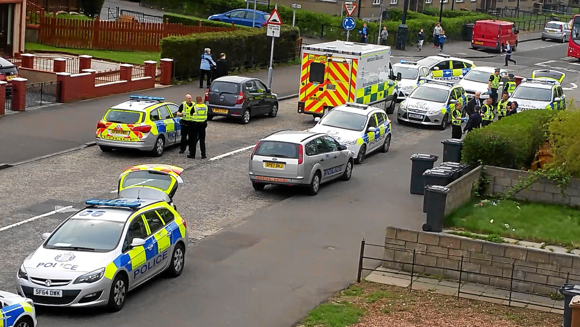 Police officers and an ambulance crew attend the alleged incident, which took place at Balunie Avenue in Douglas.