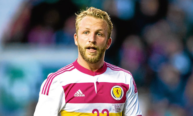 Former United man Johnny Russell in action for Scotland. He is one of Shankland's main rivals for a starting spot in Steve Clarke's side.