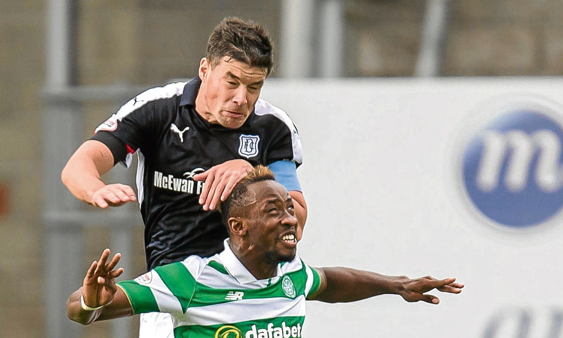 Darren O’Dea outjumps Celtic’s Moussa Dembele at Dens on Saturday. Picture by David Young
