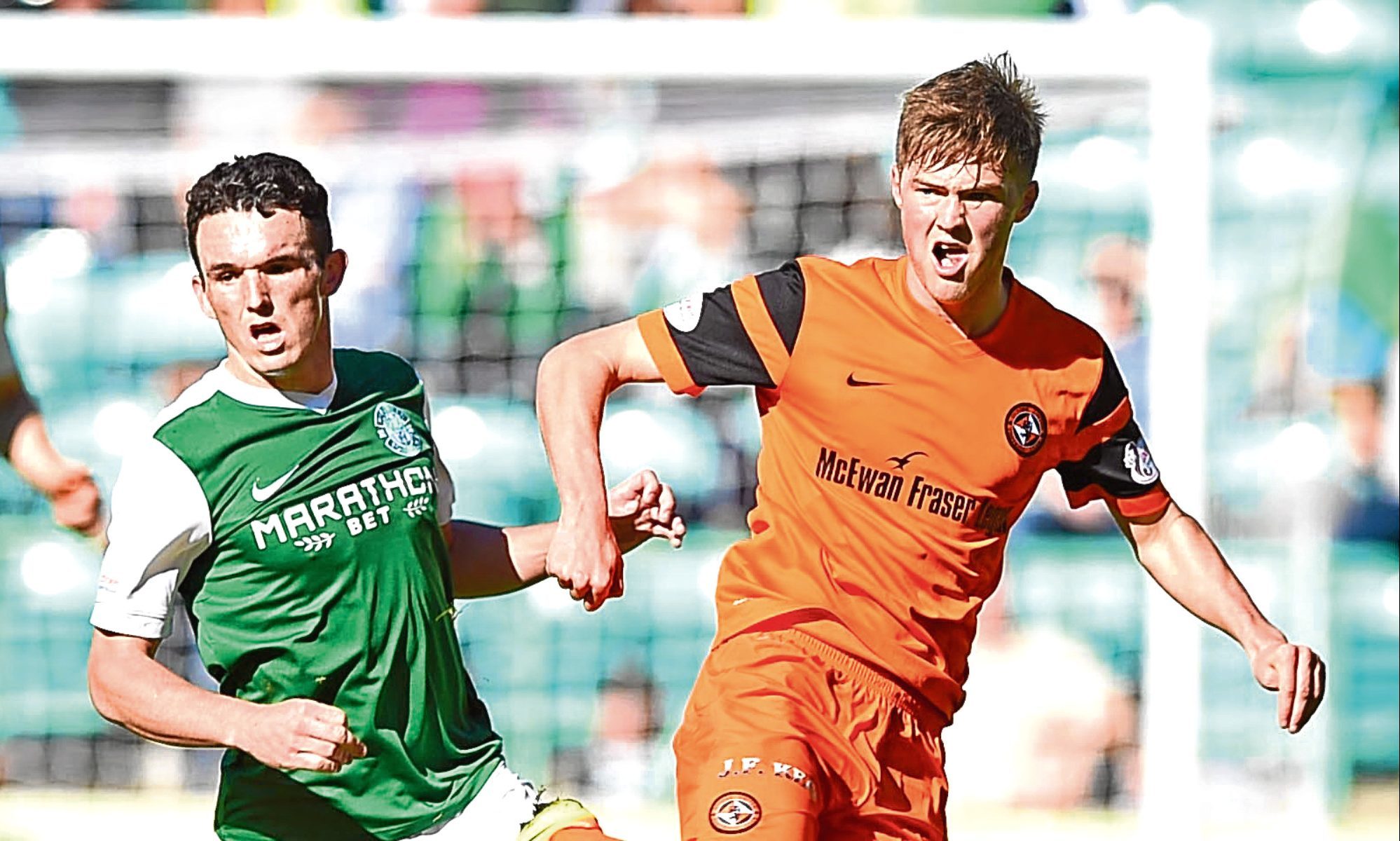 Dundee United’s Blair Spittal and Hibs’ John McGinn keep their eyes on the ball during last weekend’s hard-fought Championship draw at Easter Road.