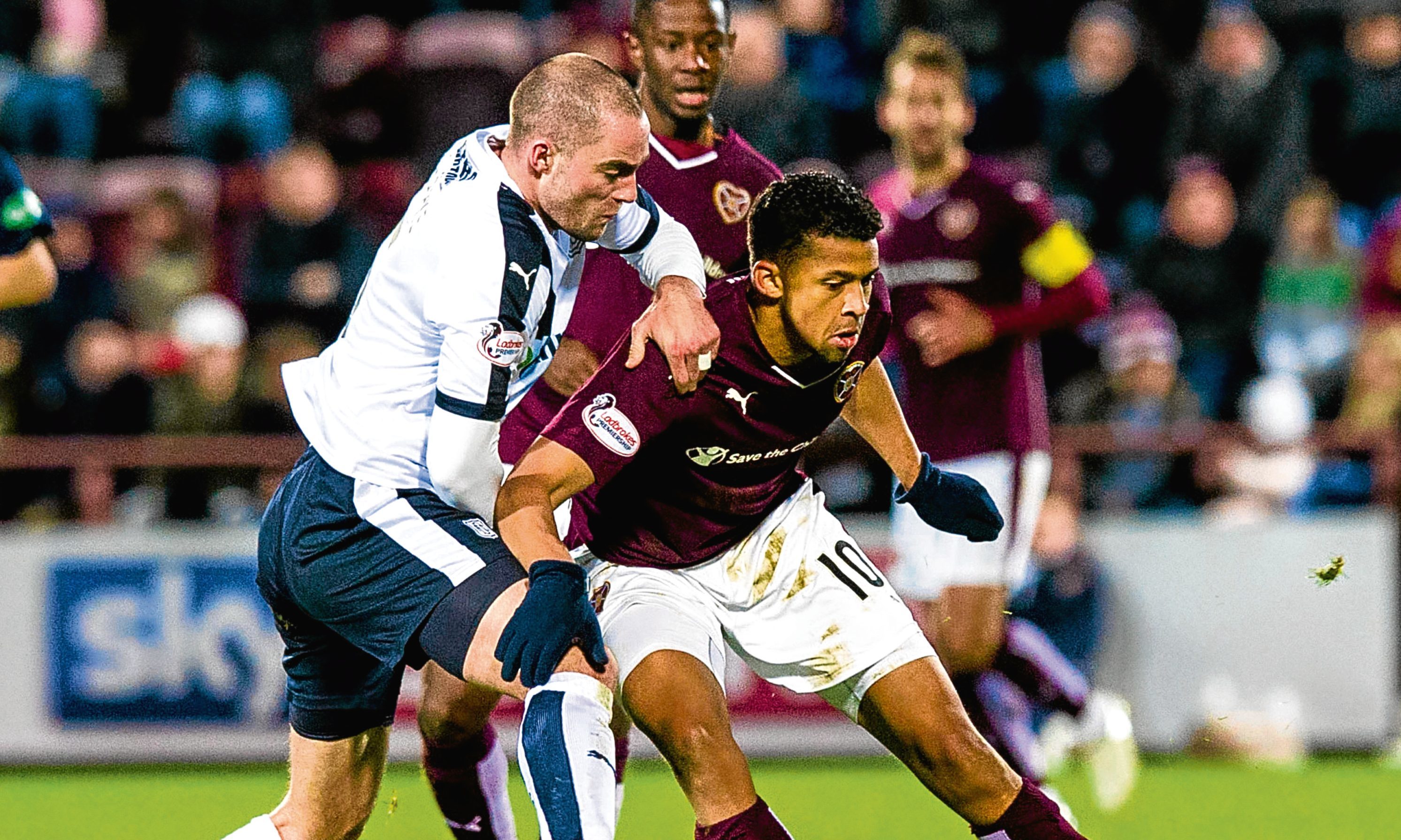 Dundee captain James McPake battles for the ball with Osman Sow at Tynecastle in the Dark Blues only point against Hearts last term.