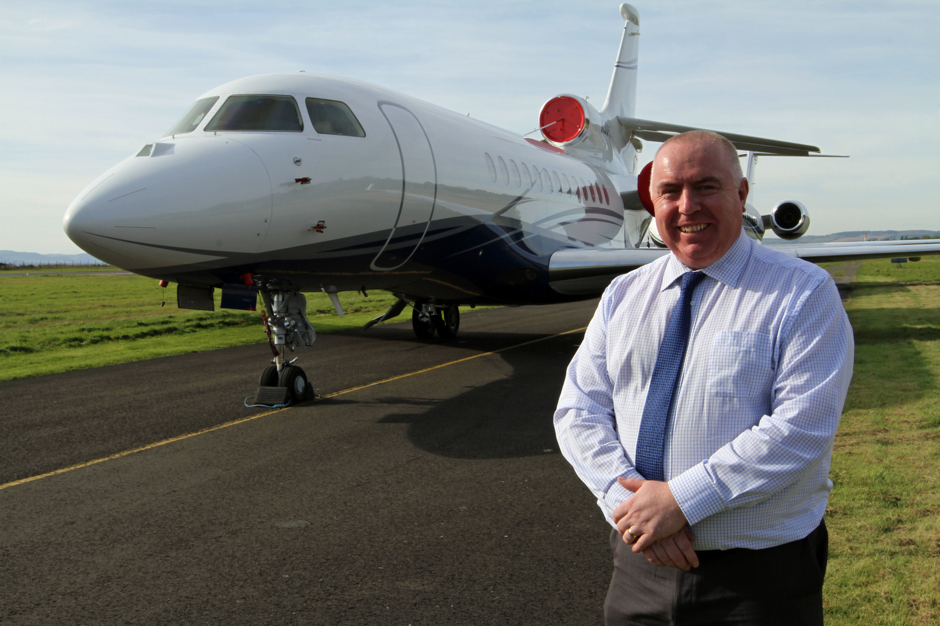 Dundee Airport manager Derrick Lang beside one of the jets.
