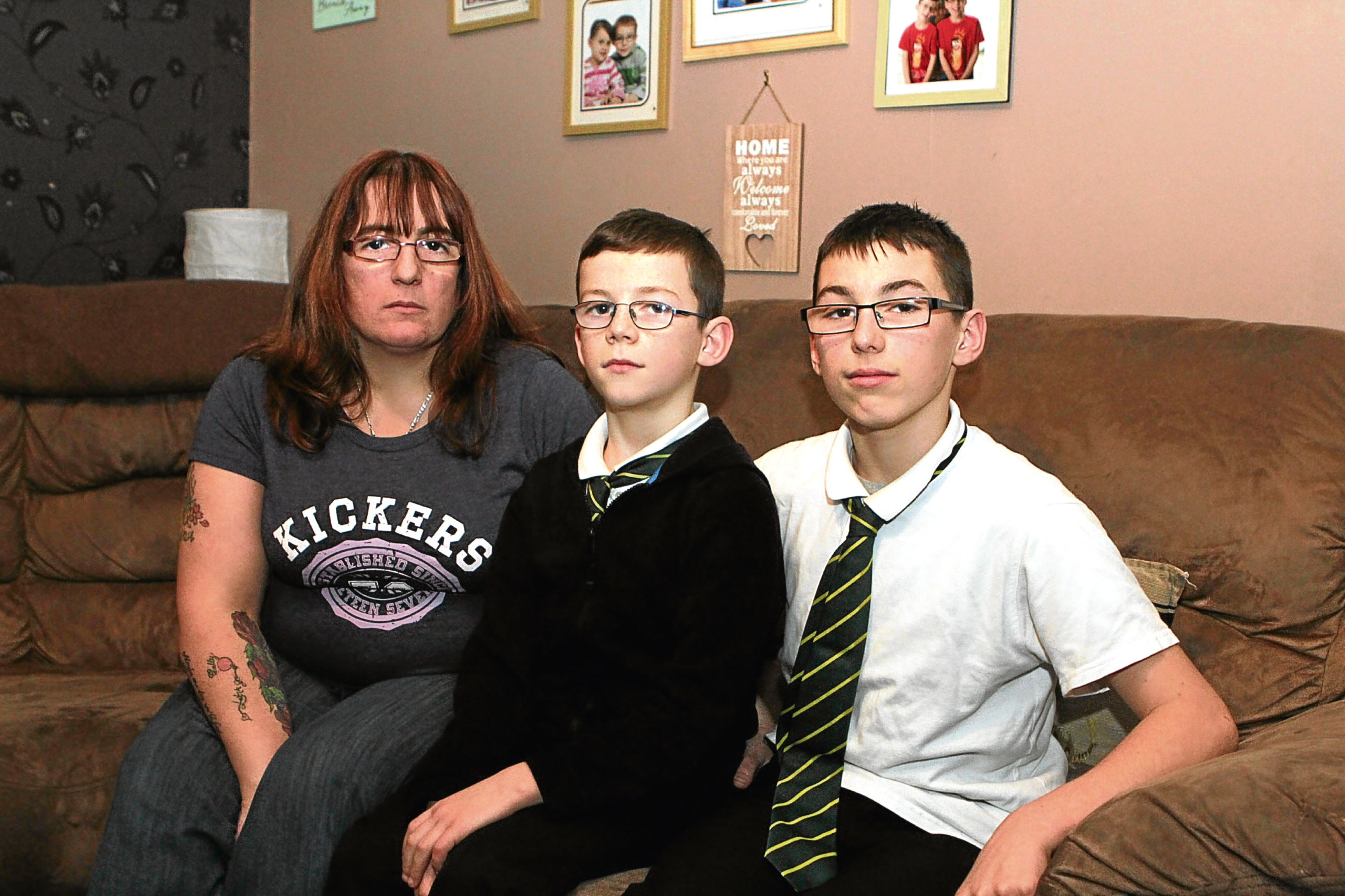 Kerry with sons Callan and Keiran. The pair were followed by a group of youths and Keiran was assaulted.