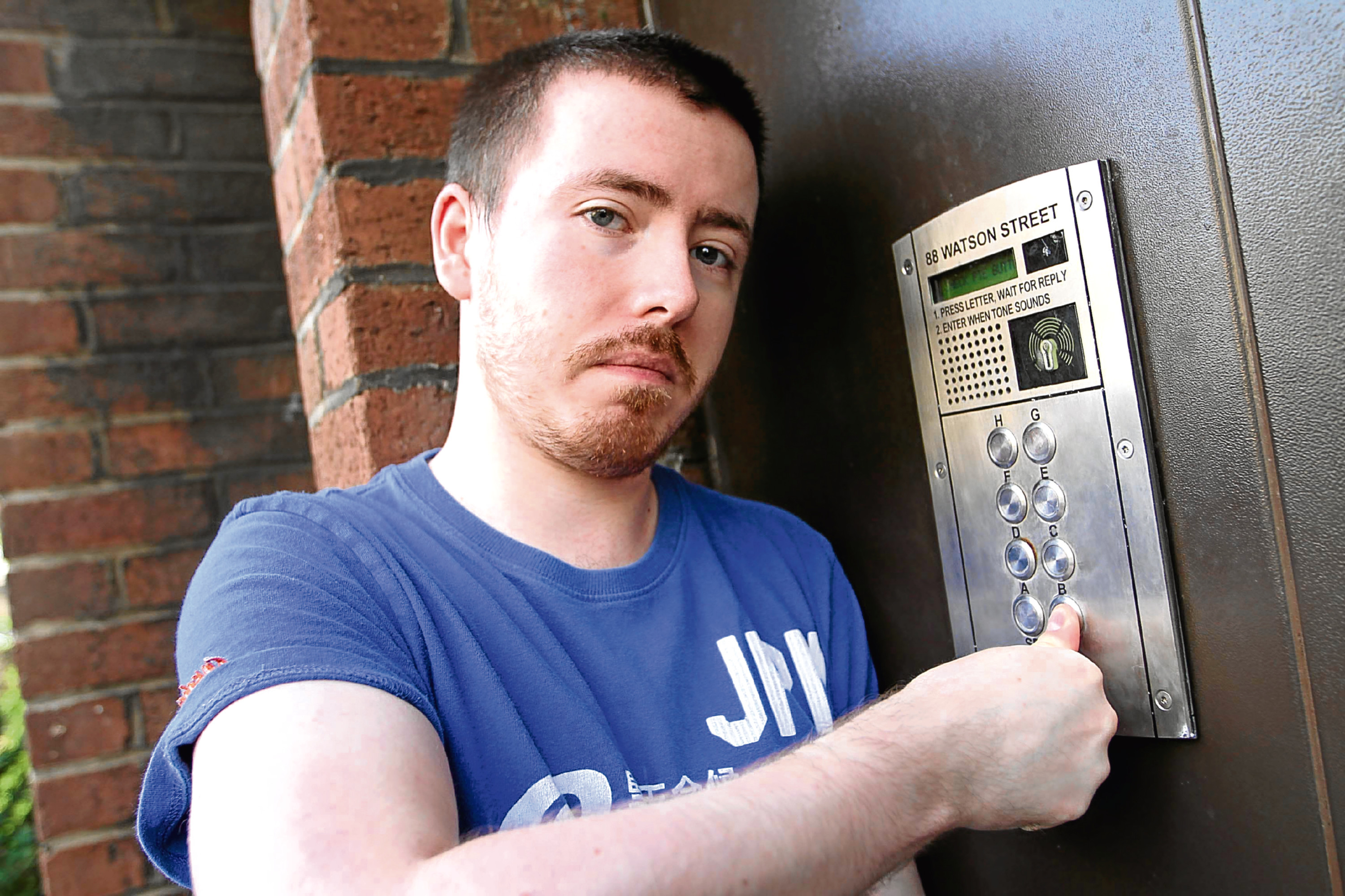 Dale White trying out one of the super glued entry buttons to his block of flats.