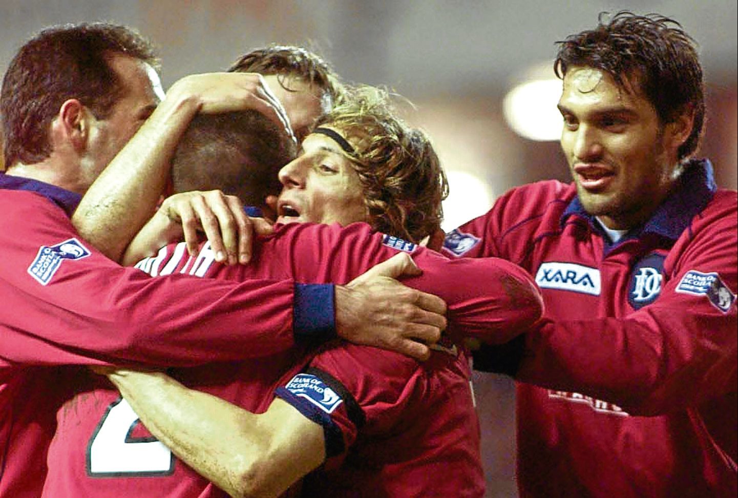 Claudio Caniggia is mobbed by his team-mates after scoring the opener for Dundee when they beat Rangers 2-0 at Ibrox in March 2001 — the last time the Dee tasted success at the Govan stadium.