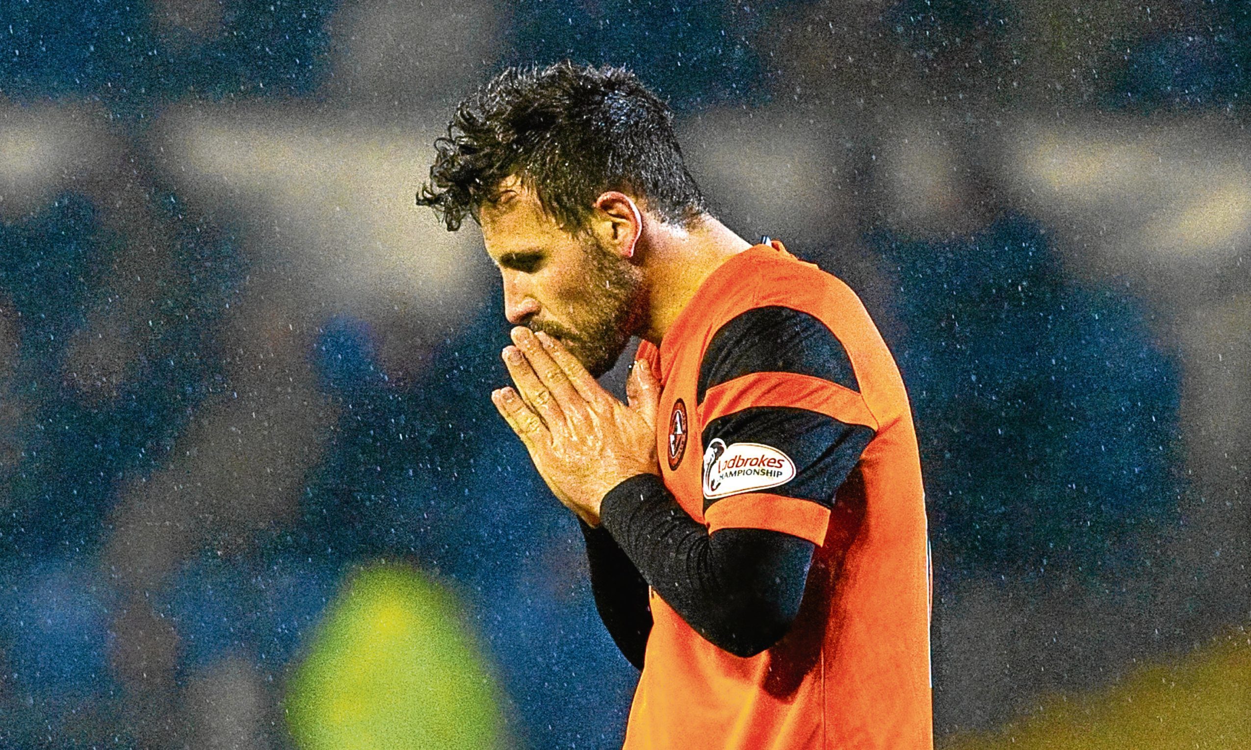 Dundee United midfielder Tony Andreu leaves the Cappielow pitch dejected at not picking up three points on Saturday.