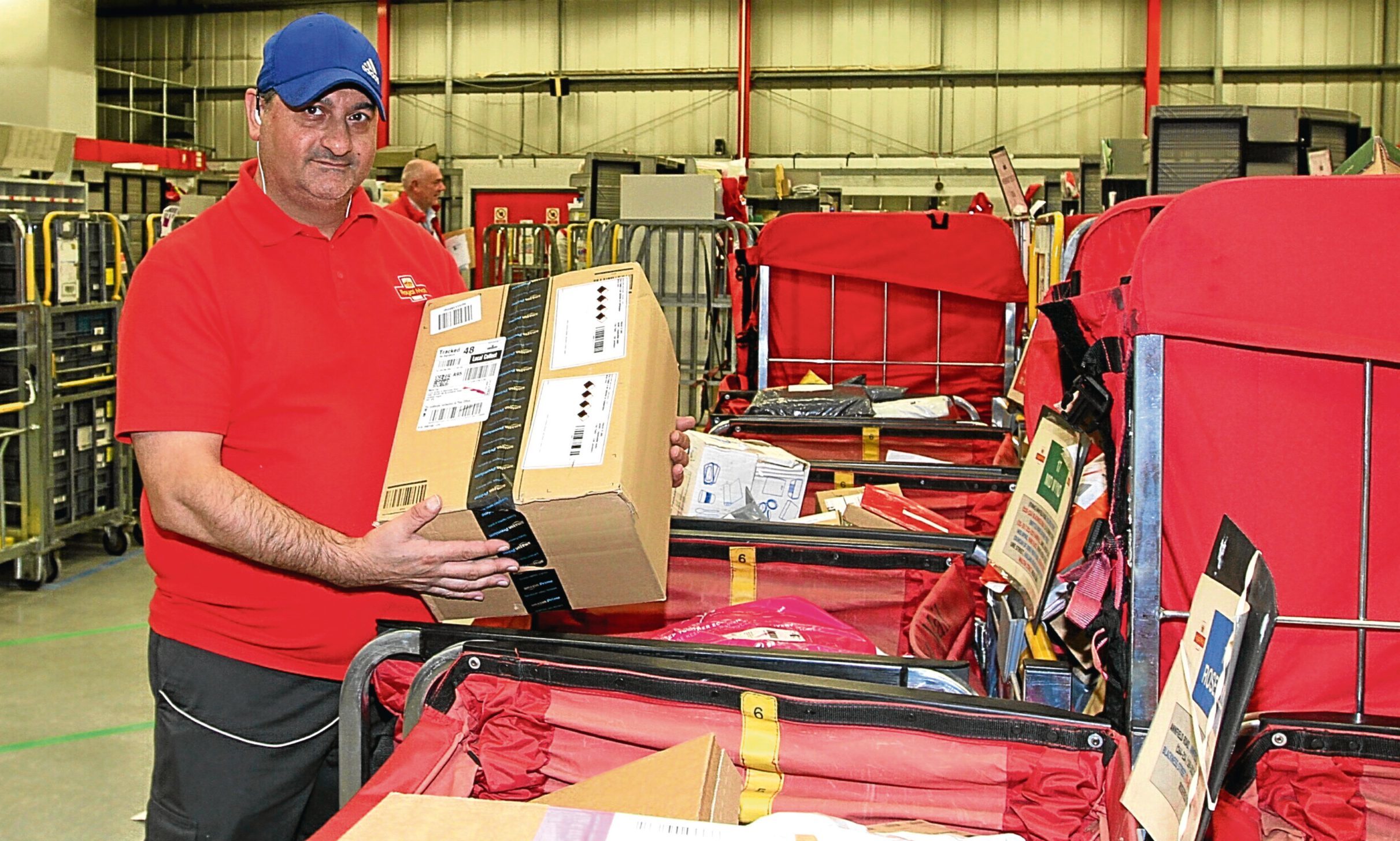David Fotheringham begins the daunting process of sorting the festive mail.