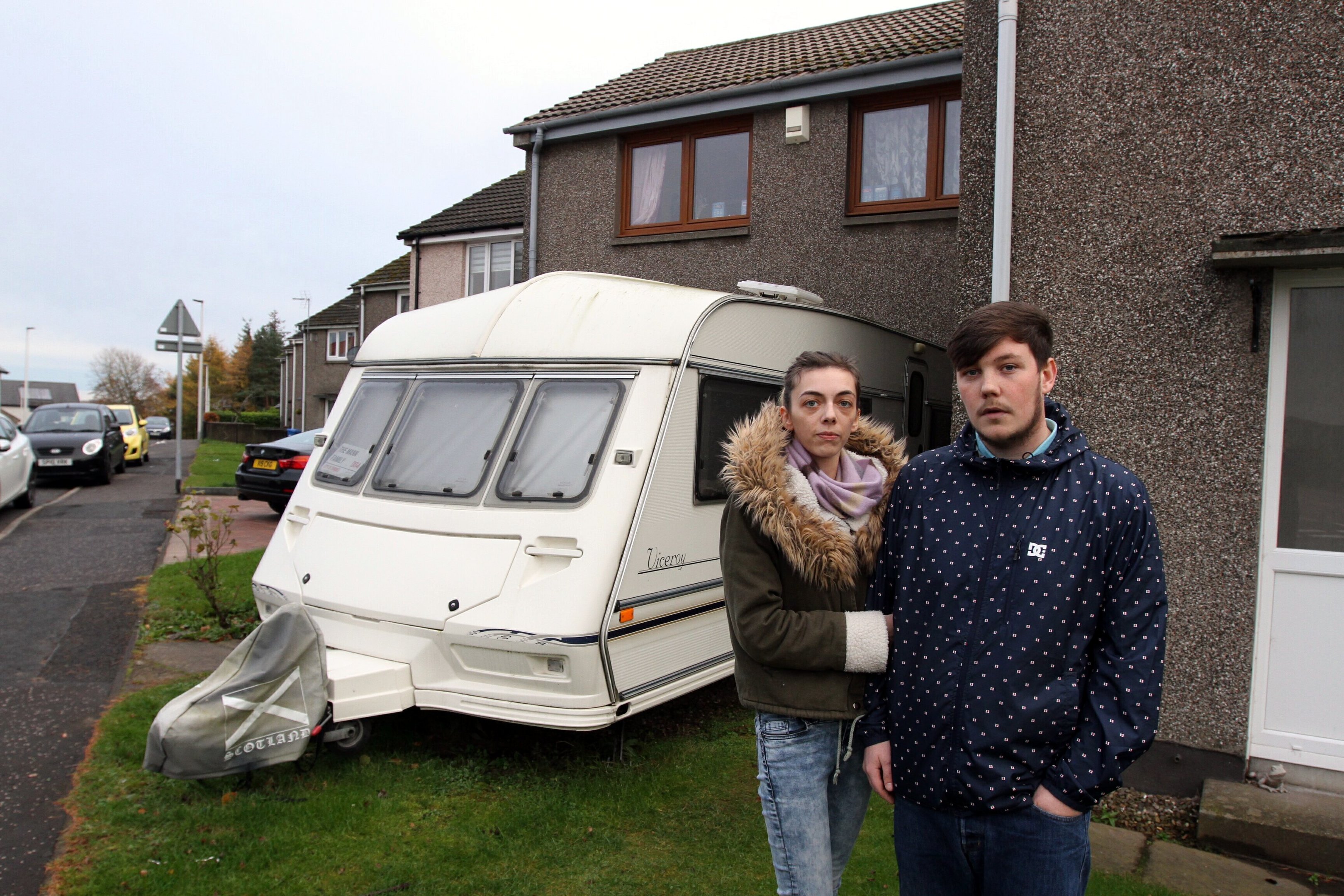 The couple beside their caravan in Mill o' Mains
