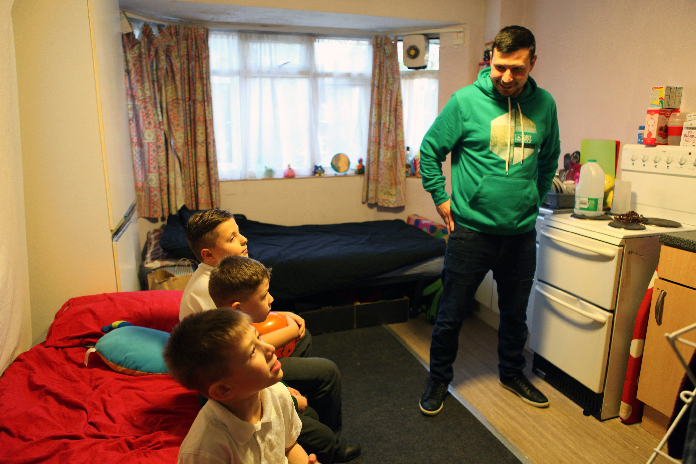 One man and his children who are living in an emergency hostel after becoming homeless.