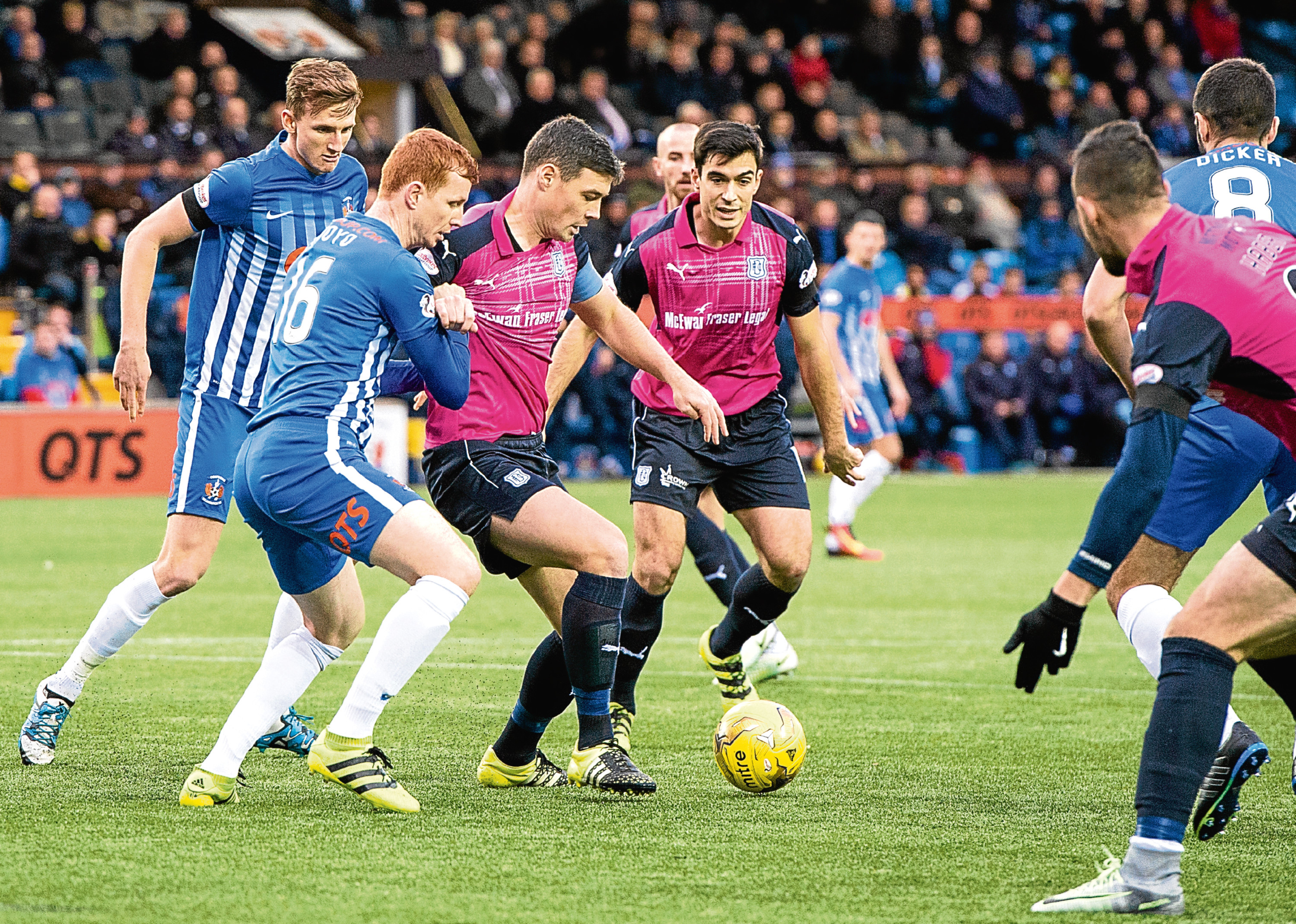 Darren O’Dea (centre) holds off Scott Boyd as the Dark Blues slip to a 2-0 defeat at Kilmarnock — something the Dundee defender is determined to correct this weekend with another home win.