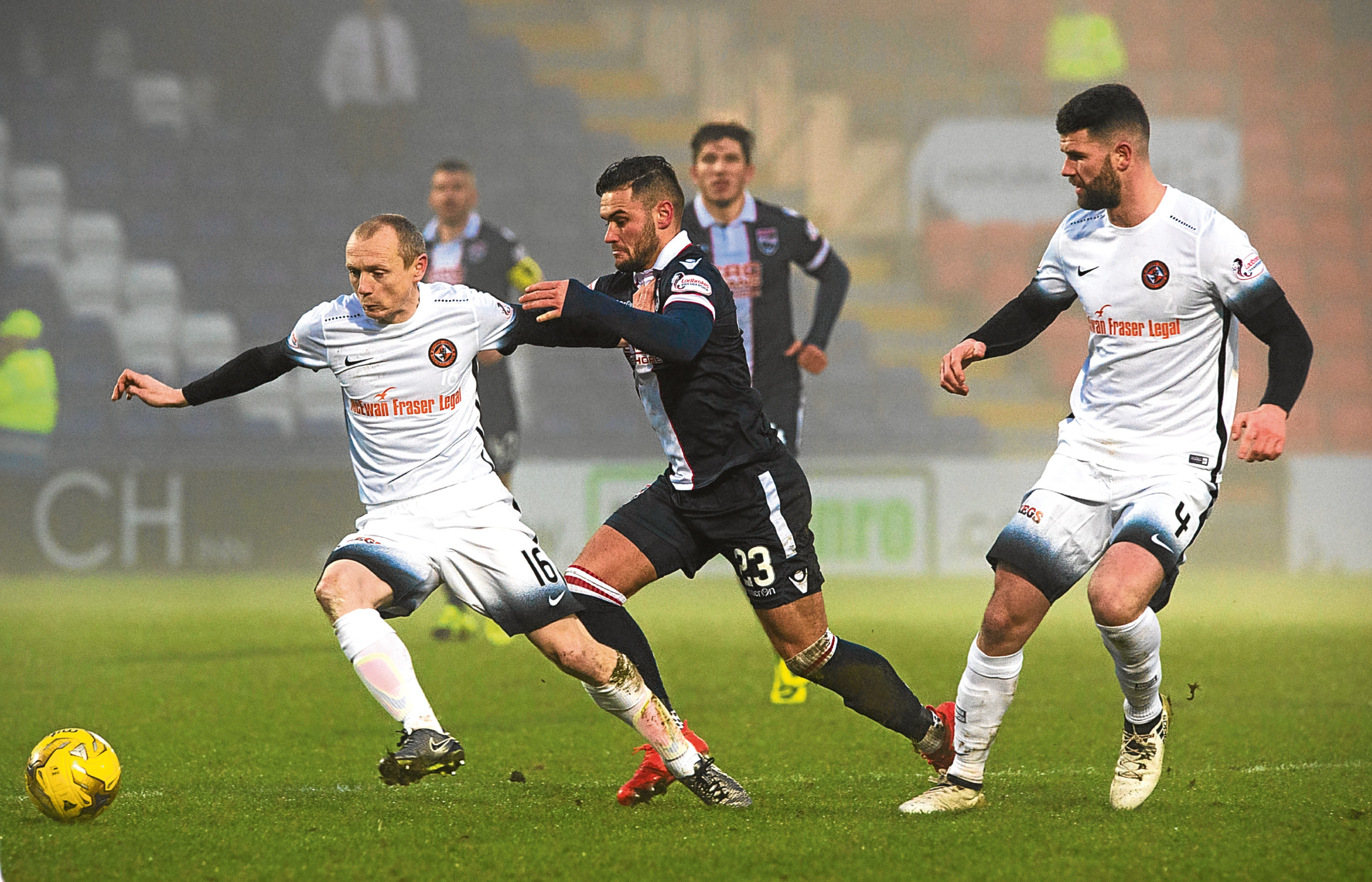 Willo Flood (left) and Mark Durnan try to halt Alex Schalk.