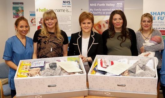 First Minister Nicola Sturgeon gifts first Baby Boxes to expectant parents at the launch of the scheme
