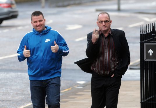 Badger baiting father and son, John Murray Snr and John Murray Jnr arriving at Hamilton Sheriff Court