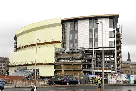 The new Dundee railway station building, which is under construction at the Waterfront. Cladding is now being added to the exterior of the structure