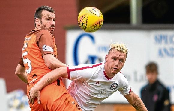 Dundee United’s Paul Quinn is back training after a recent health scare sidelined the defender.