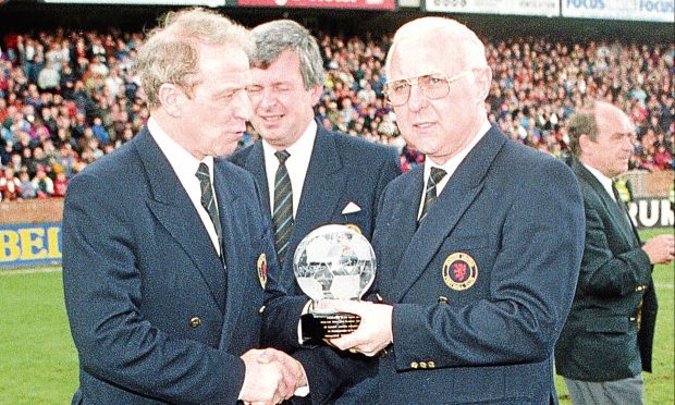 Dundee United manager Jim McLean (right) receives an award after his last game in charge.