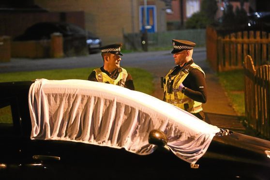 Police at the scene in Pitairlie Road.
