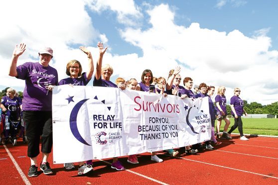 The start of the relay at the athletics track in Caird Park