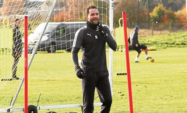 Dundee's James McPake returns to training