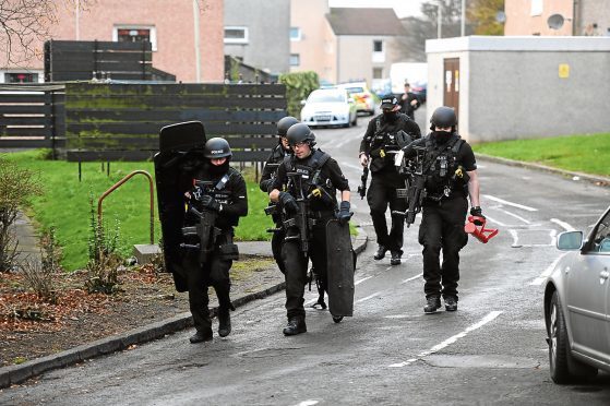 Police activity at the incident in Yarrow Terrace, Menzieshill