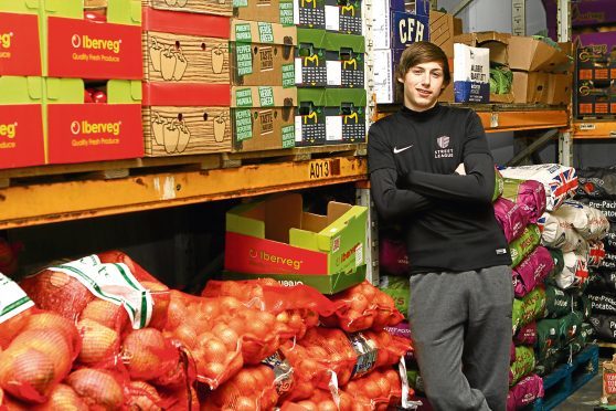 Conor Nelson at work in the warehouse at Les Turriff