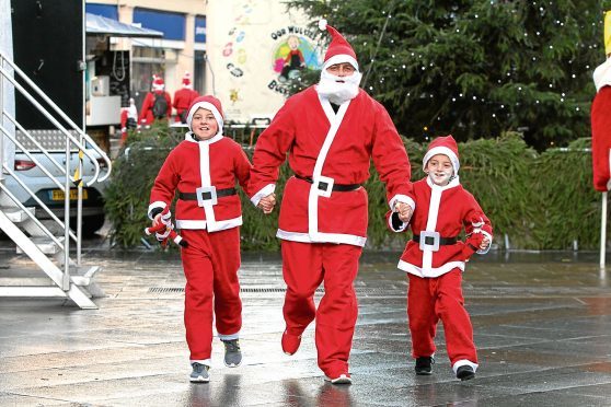 Participants in the inaugural Santa Dash fundraiser, which was held in the city to raise funds for the Archie Foundation.
