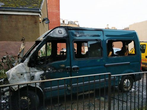 One of the fire-ravaged minibuses.
