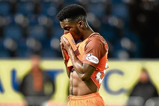 A dejected Brandon Mason walks off the pitch at the final whistle after seeing Dundee United lose 6-1 to Falkirk.