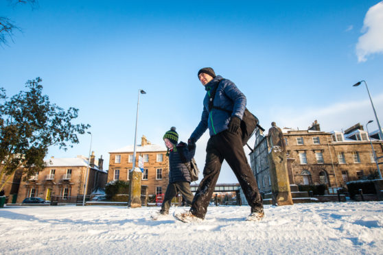 Matthew Mackie and son John Mackie (aged 6, from Inchview Primary School) on walk to school in South Inch, Perth