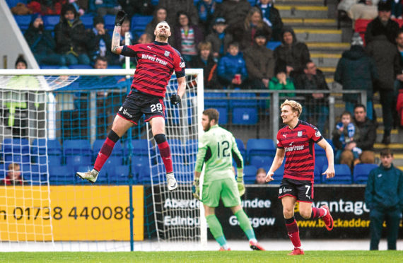 Striker Marcus Haber leaps for joy after putting Dundee ahead against St Johnstone at McDiarmid Park.