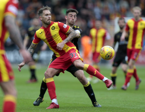 Martin Woods in action for Partick Thistle last season