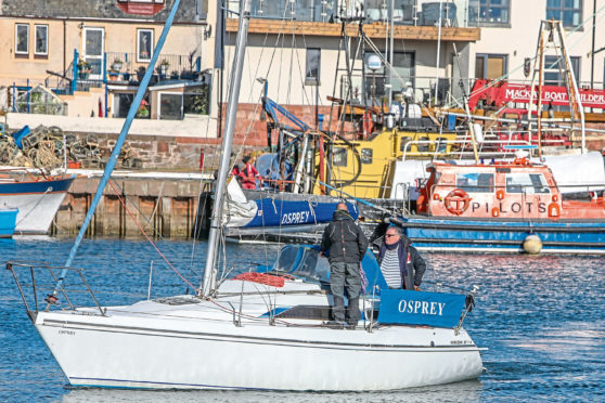 The yacht's owner brings the boat back in to Arbroath Harbour.