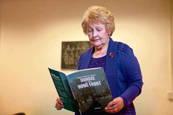 Linda Nicoll with her new book at Dundee City Archives