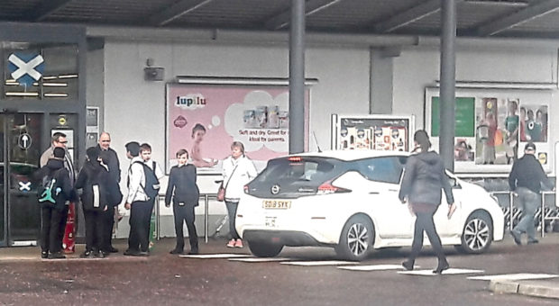 Pupils outside the Lidl in Dura Street, stobswell