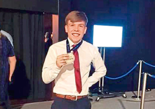 Paul Anderson with his medal
