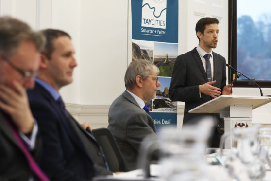 John Alexander speaks at the announcement of the deal.