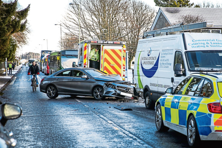 Police and ambulance called after crash blocks Dundee road, no bus access Evening Telegraph