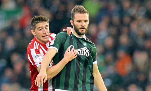Jamie Ness, right, in action for Plymouth.