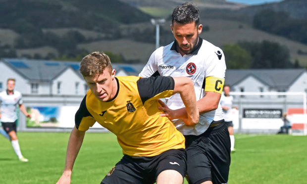 Dundee Uniteds Nicky Clark in action against Dumbarton in a pre-season friendly.