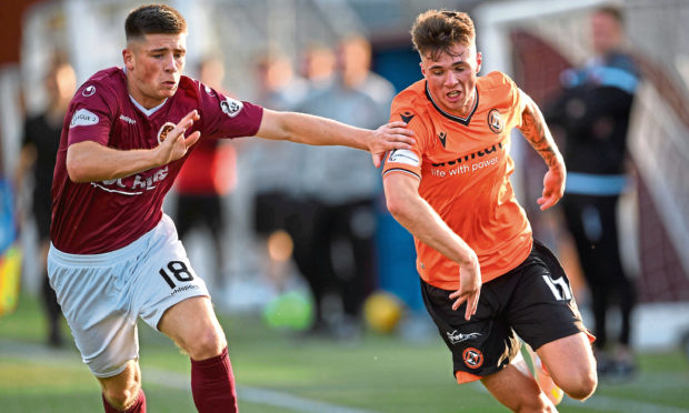 Stenhousmuir's Liam Scullion and Dundee United's Jamie Robson in action.