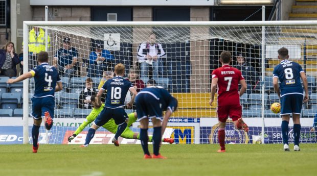 Dundee's Danny Johnson scores the opening goal.
