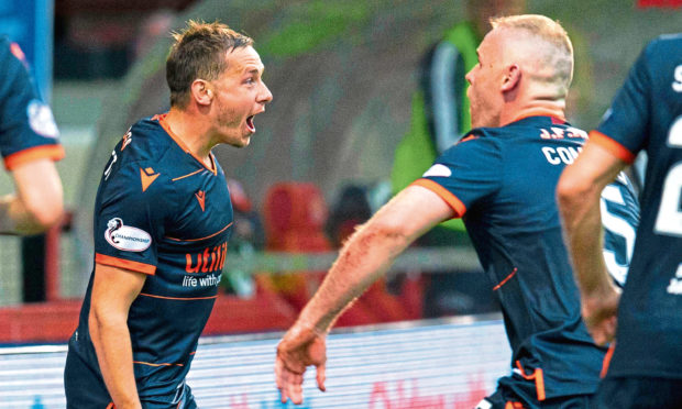 Peter Pawlett celebrates with Mark Connolly after making it 2-1 to Dundee United on Saturday.