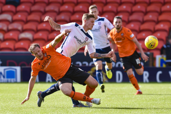 Dundee United's Peter Pawlett (L) in action with Arbroath's Thomas O'Brien during the Tunnock's Caramel Wafer Challenge Cup match between Dundee United and Arbroath on September 7.