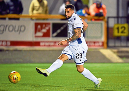 Dundee's Kane Hemmings scores the opening goal.