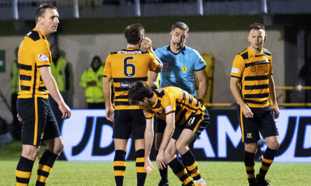 The Alloa Athletic players appeal to referee Greg Aitken following the sending off of Iain Flannigan.