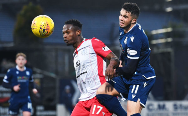 Dundee's Declan McDaid (R) and Queen of the South's Abdul Osman in action at Dens Park.