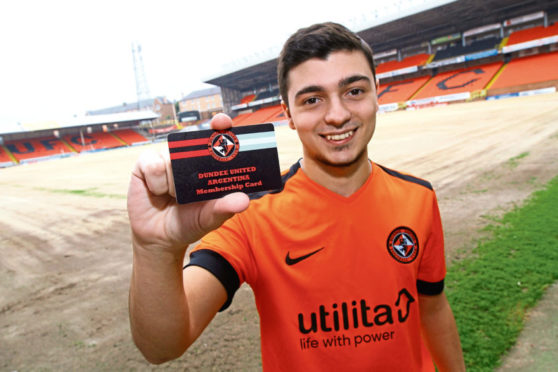 Agustin Mervic from Buenos Aires shows off his Dundee United Argentina supporters Club card at Tannadice.