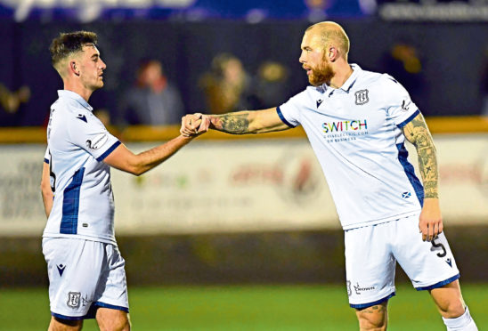 Dundee's Jordon Forster (right) celebrates with Shaun Byrne at full time of the Ladbrokes Championship match between Alloa Athletic and Dundee.