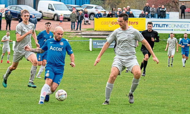 Alan Tulleth in possession for Lochee United against Hermes.