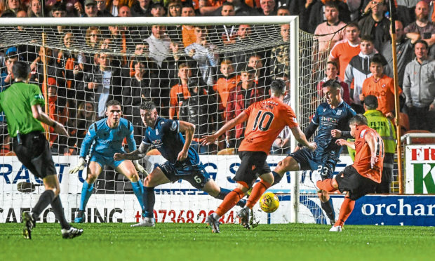 United's Cammy Smith scores to make it 6-2 during the Dundee derby in August.
